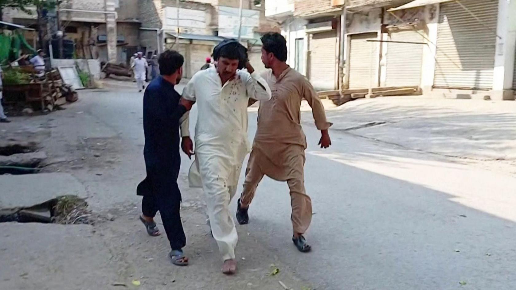 Three men moving quickly on a road