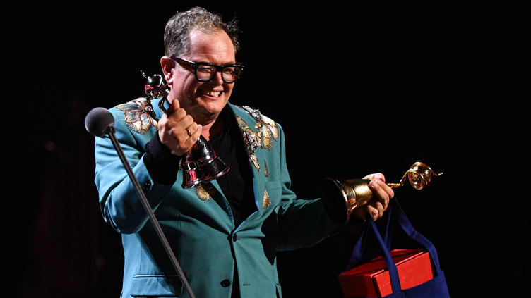 Alan Carr accepts the 'Special Recognition' award on stage during the National Television Awards 2026 show at The O2 Arena.