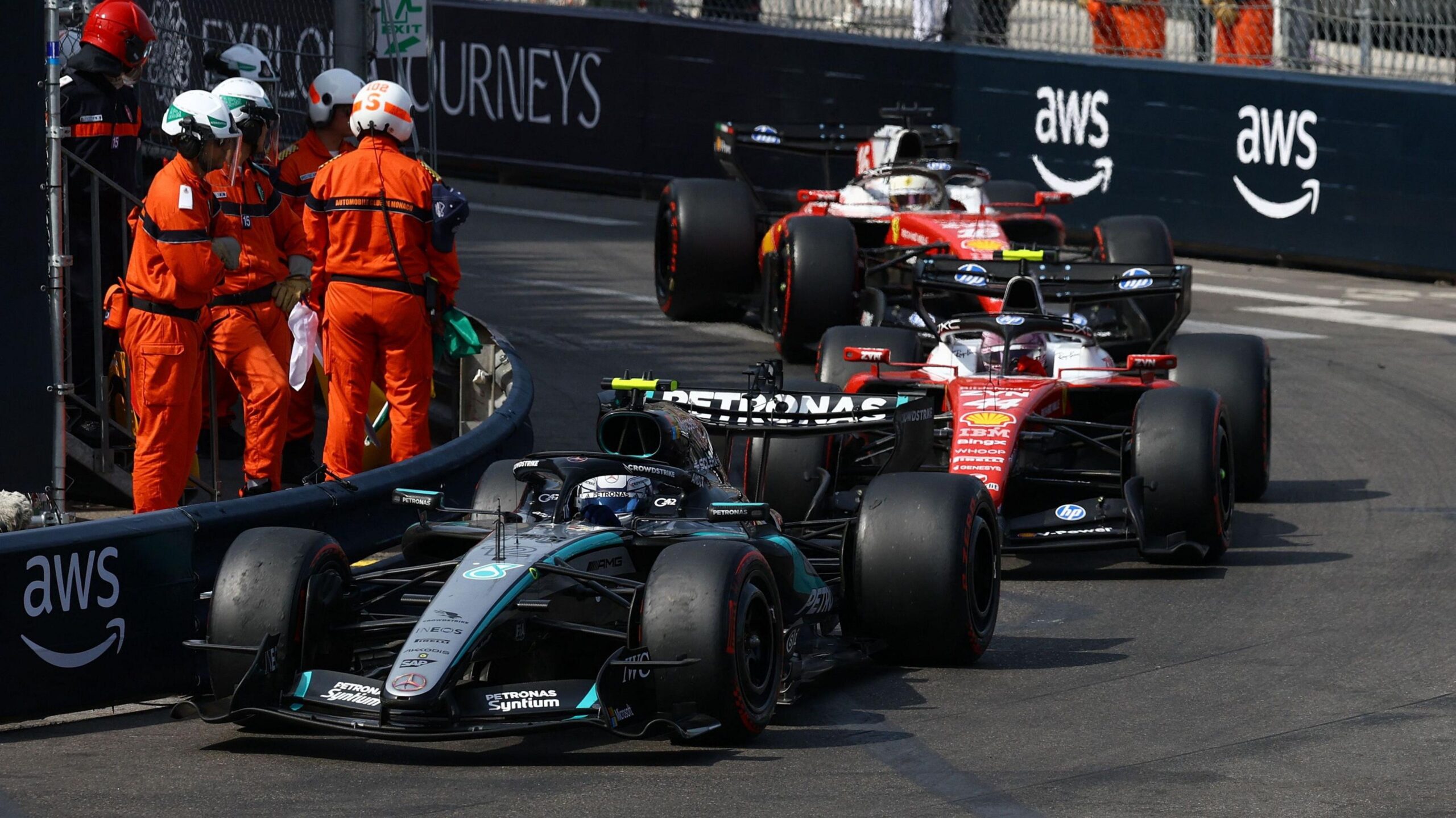 Kimi Antonelli leading the 2026 Monaco Grand Prix with Ferrari drivers Lewis Hamilton and Charles Leclerc following immediately behind him