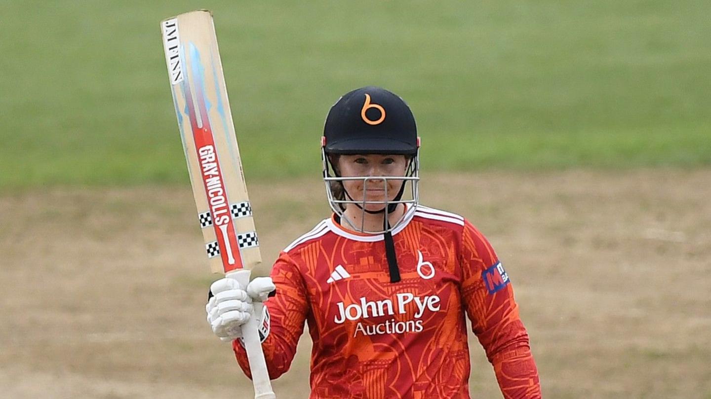 The Blaze opener Tammy Beaumont raises her bat after completing a half-century in the One-Day Cup Final against Hampshire