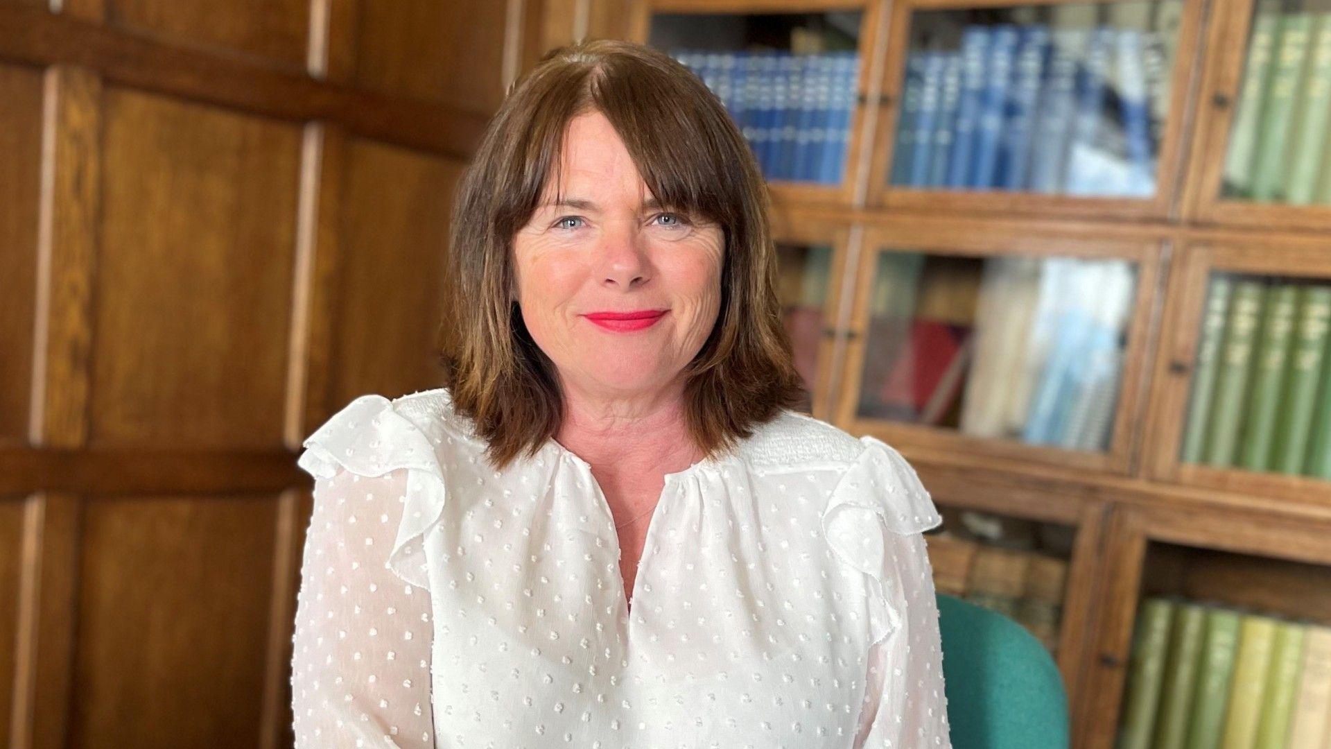 Chief Inspector of Constabulary and Fire & Rescue Services Michelle Skeer, smiling at the camera, wearing a white shirt.