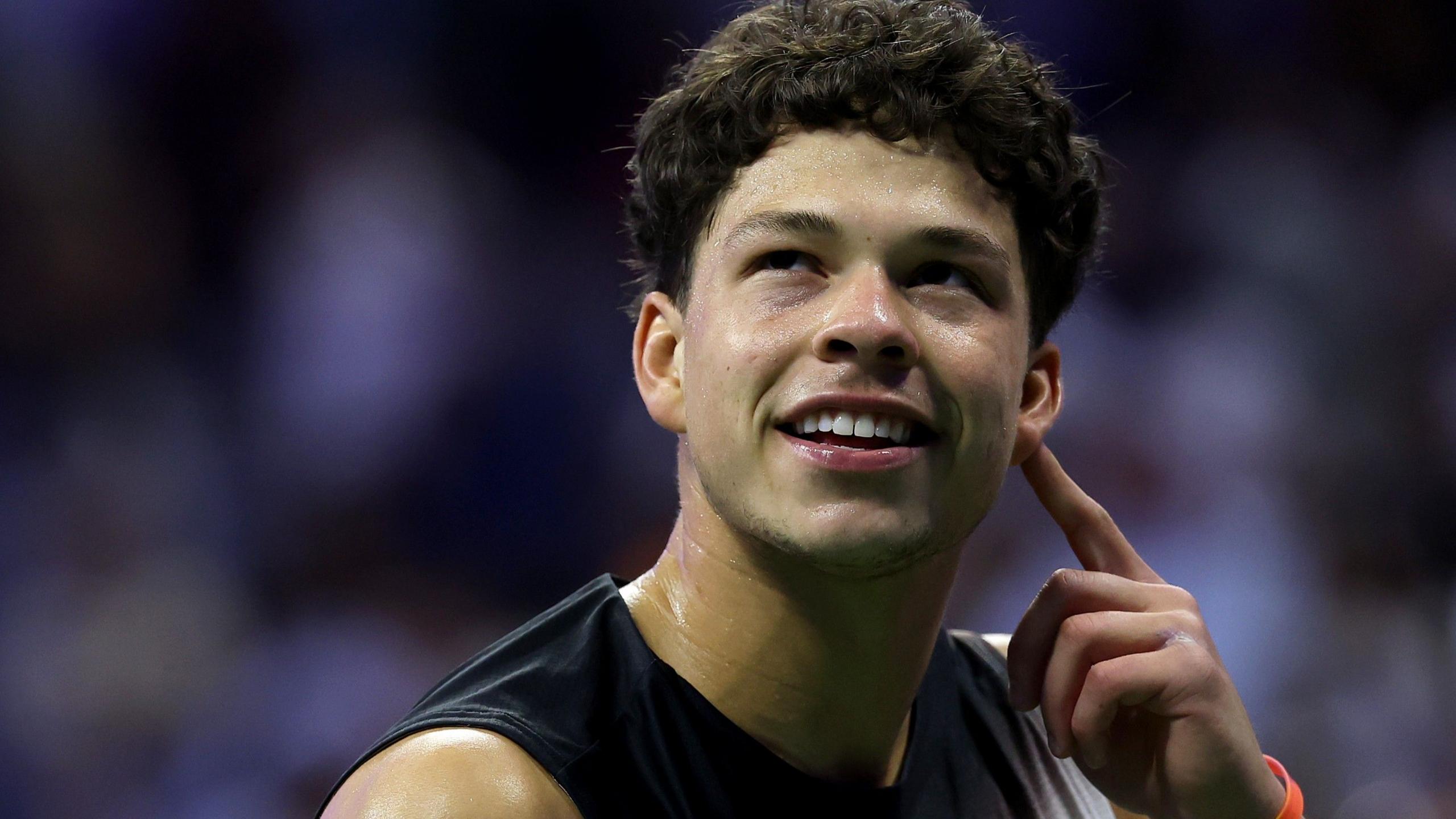 Ben Shelton smiles after winning his US Open semi-final