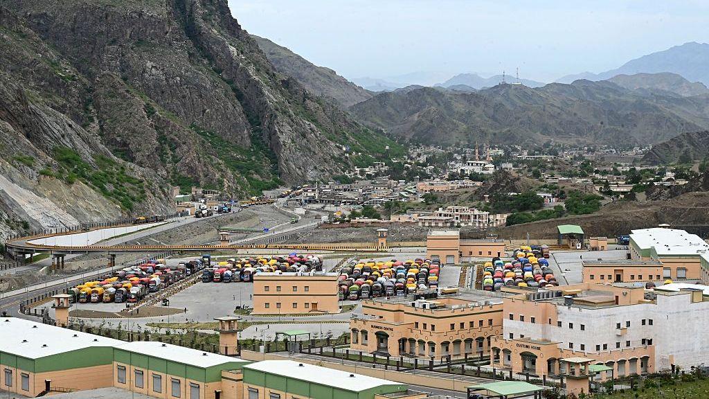 Afghan refugee trucks are parked along the Landi Kotal highway near the Torkham border in Pakistan's Khyber Pakhtunkhwa province, as they await deportation to Afghanistan on April 28, 2026