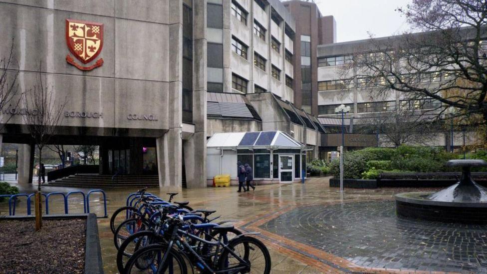 outside Woking council, a grey concrete building