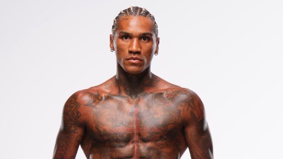 Conor Benn is shirtless and wearing black shorts
