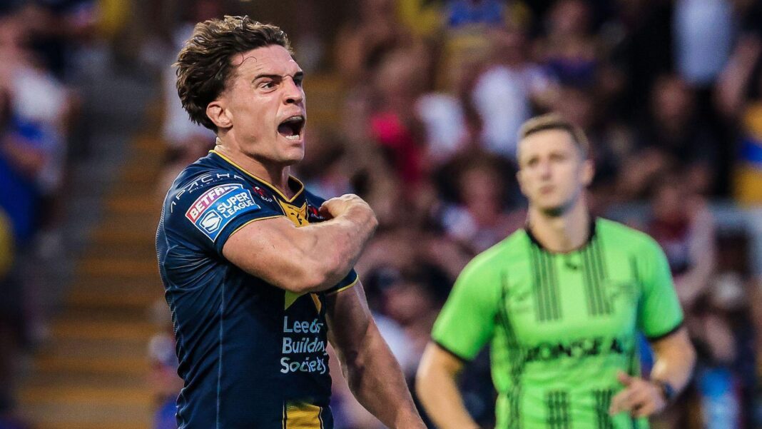 Brodie Croft roars in delight after scoring, pumping his muscles with passion in celebration