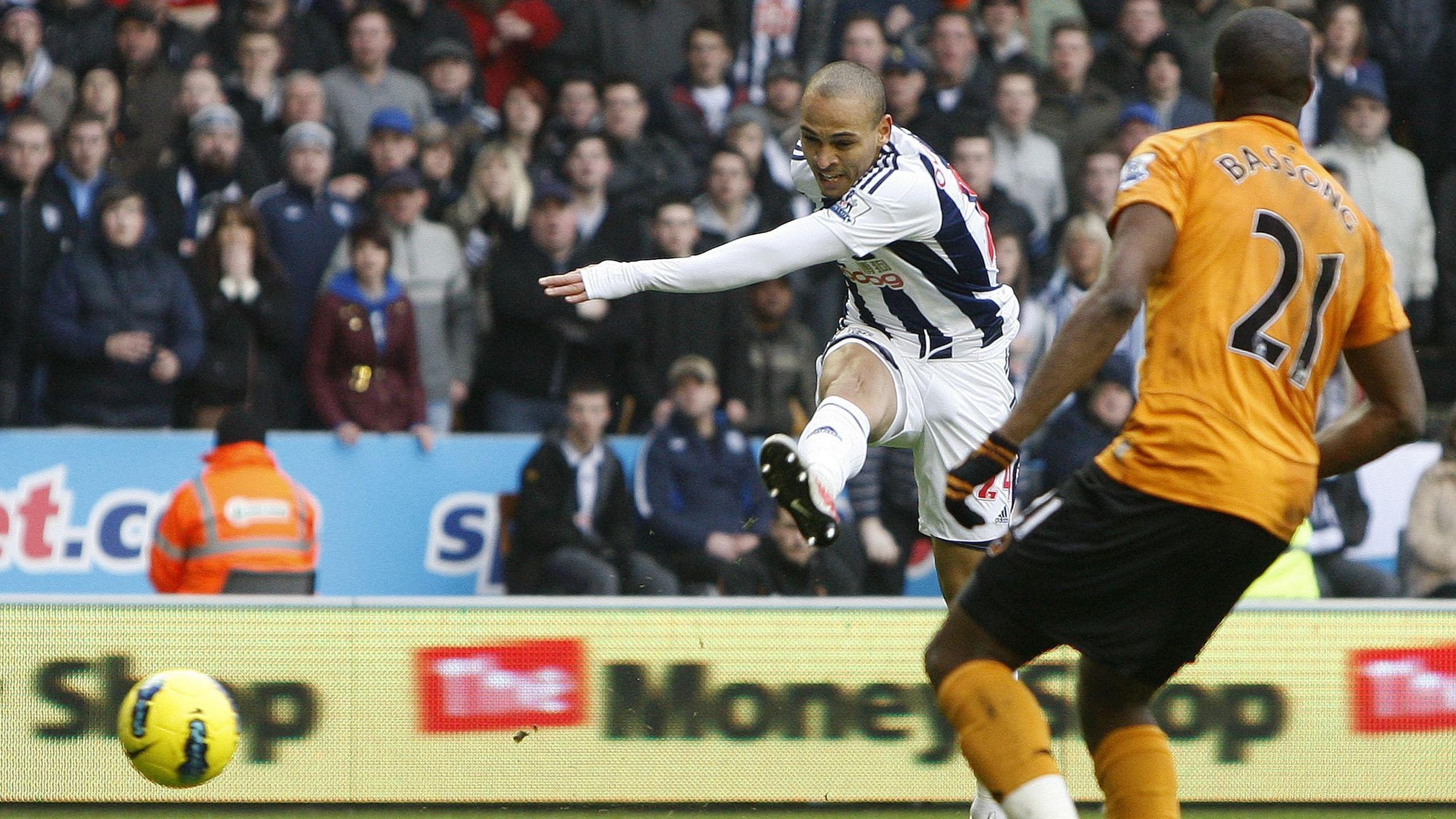 West Bromwich Albion striker Peter Odemwingie fires in his hat-trick goal at Molineux in the Baggies' 5-1 win over Wolves (12 February 2012)