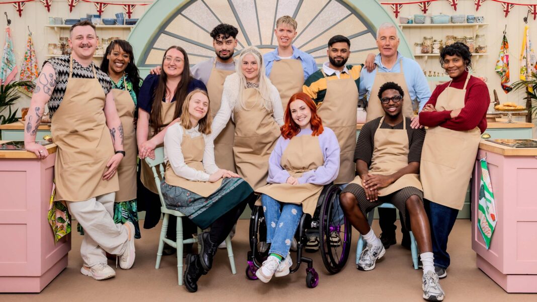 The twelve new Bake Off contestants pictured on the kitchen set - L-R Gabe, Nikki, Shannon, Danni, Mo, Clara, Tom, Molly, Yannis, Gary, Moyin, Connie