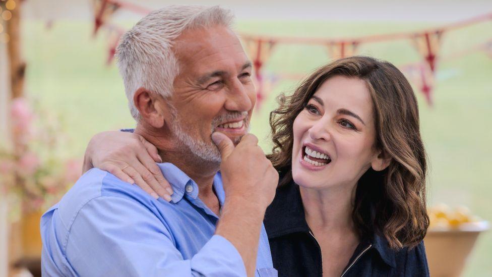 Nigella Lawson with her arm around Paul Hollywood in the Great British Bake Off tent