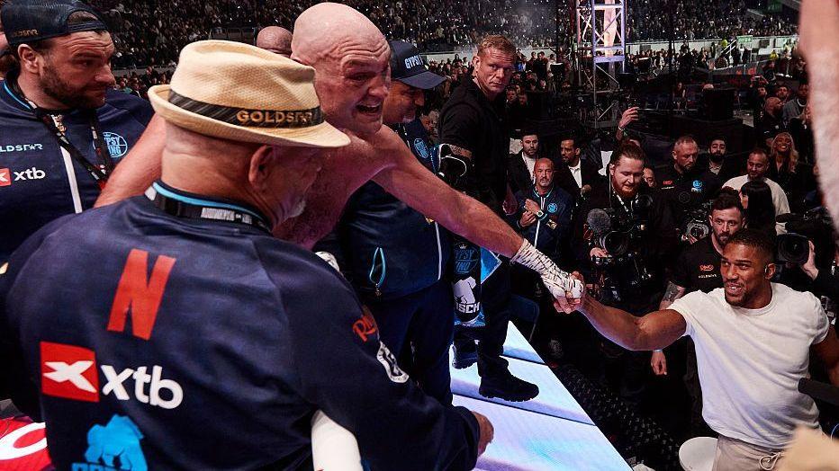 Tyson Fury and Anthony Joshua fist bump after Fury's win over Arslanbek Makhmudov