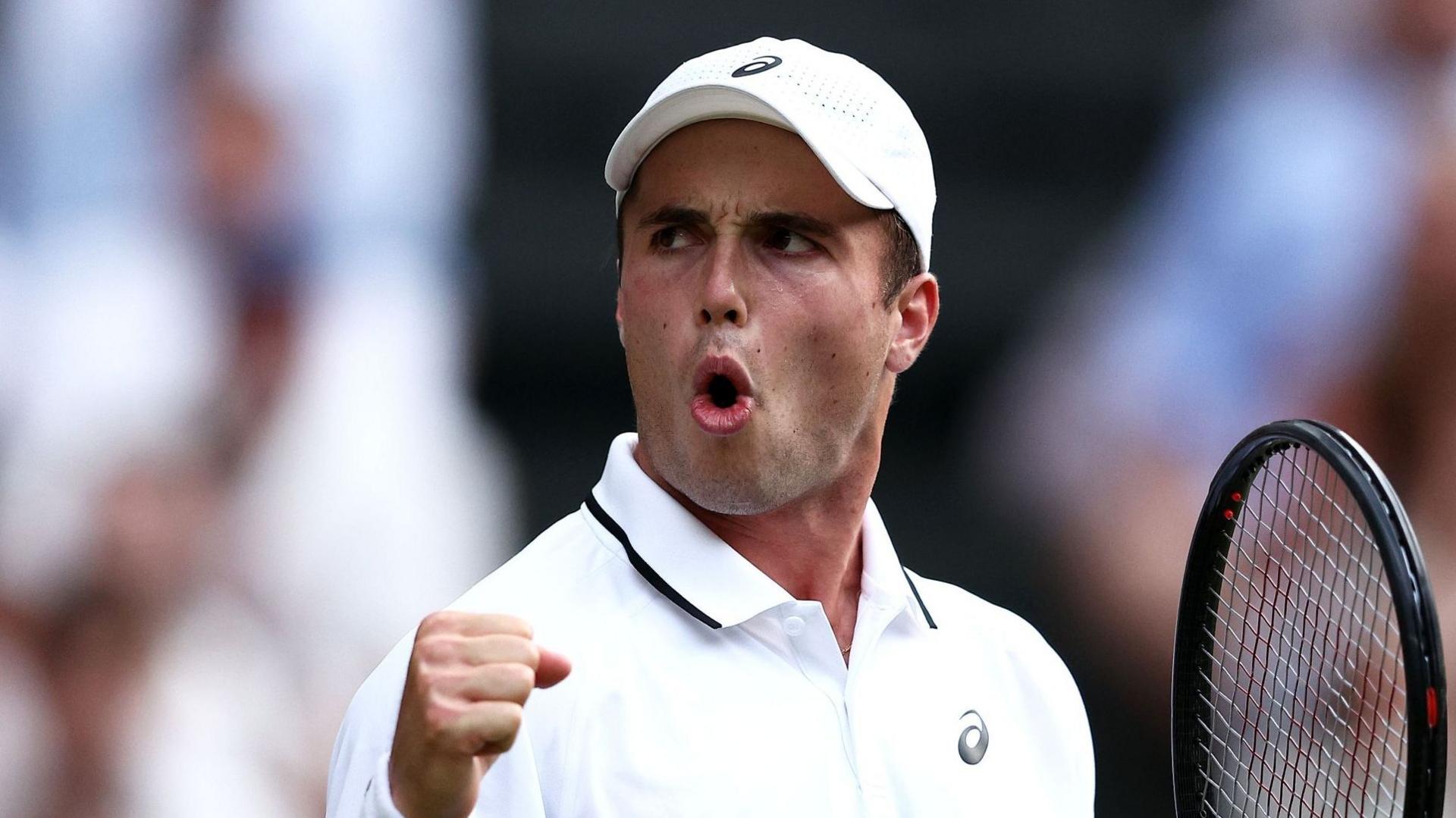 Arthur Fery reacts to winning a point at Wimbledon