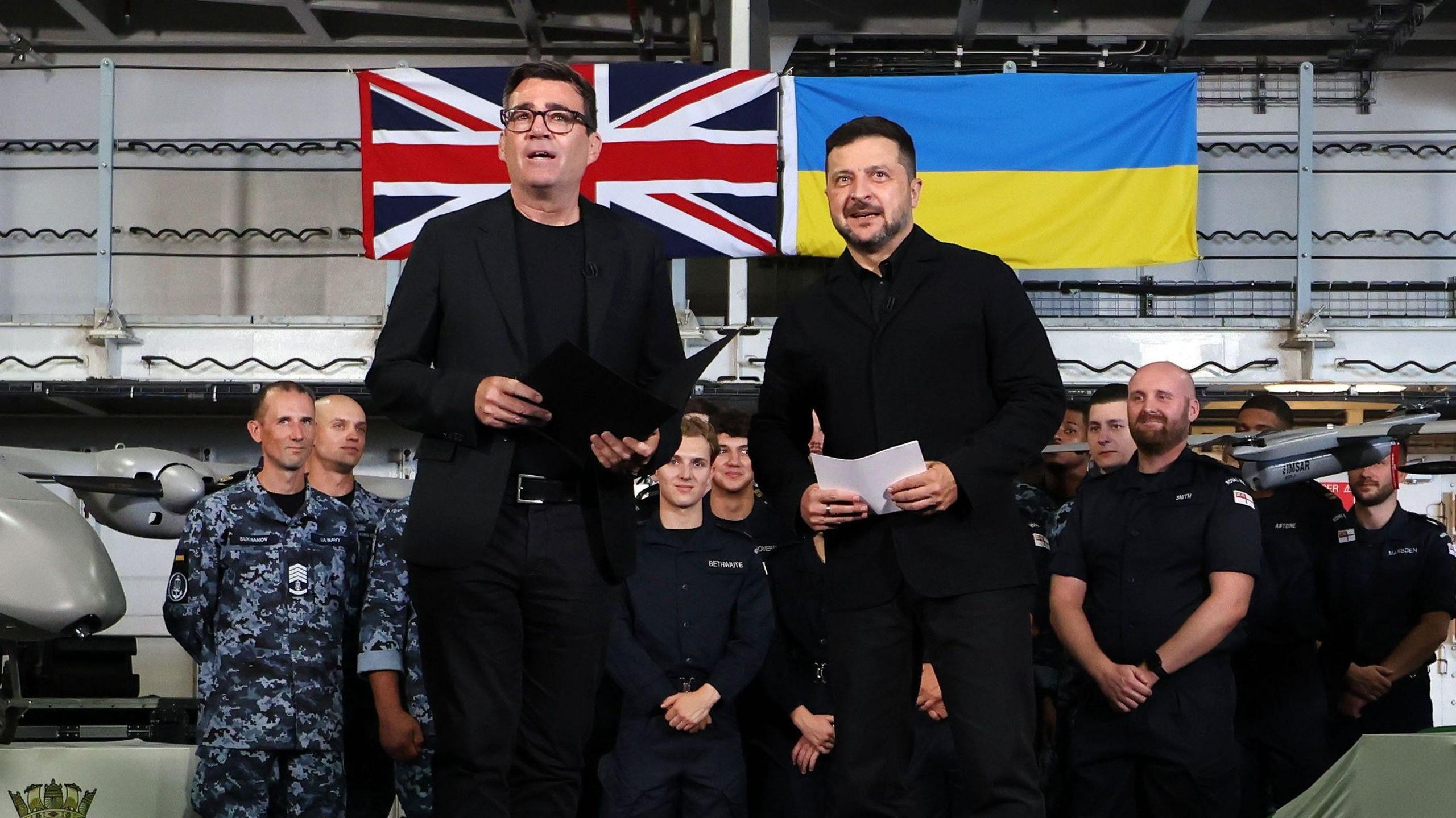 British Prime Minister Andy Burnham (L) and Ukrainian President Volodymyr Zelensky (R) with British and Ukrainian troops aboard the HMS Queen Elizabeth at His Majesty's Naval Base Portsmouth in Portsmouth, Britain, 27 July 2026.