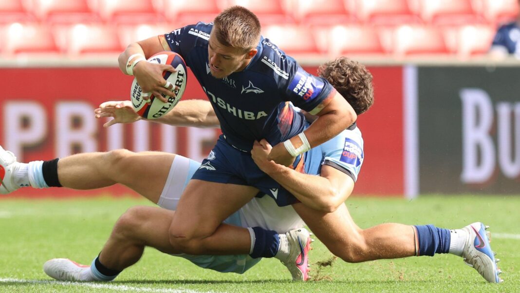 Carpenter shines in convincing Sale Prem Cup win Joe Carpenter scores his third try for Sale despite being tackled by a Bath defender