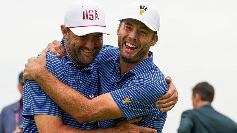 Scottie Scheffler and Sam Burns celebrate