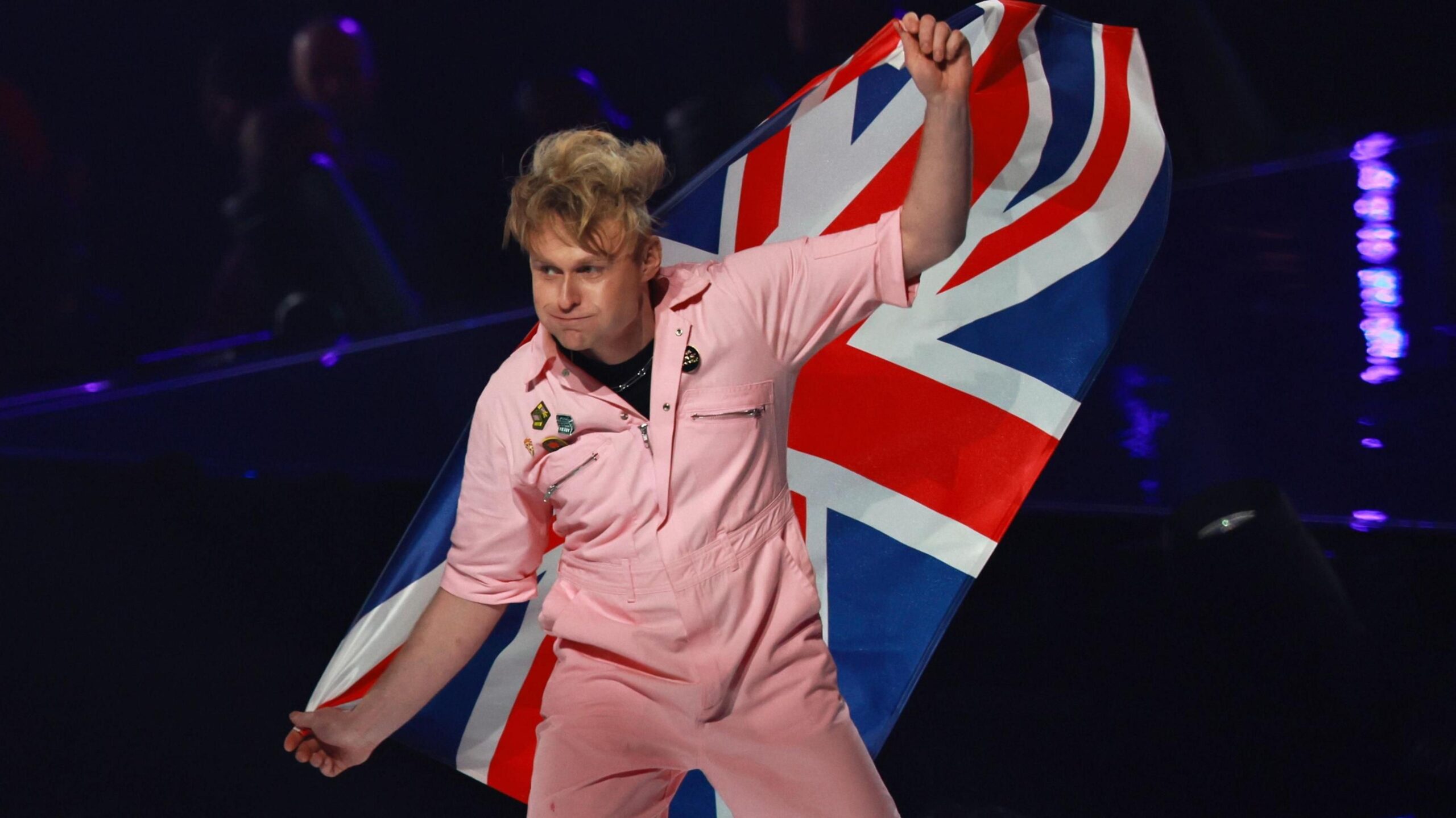 Look Mum No Computer waves a British flag as he walks onto the stage at the 2026 Eurovision Song Contest