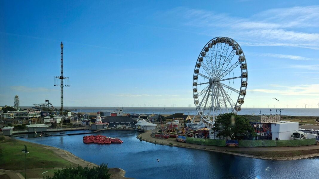 Weekend heat for parts of UK before more rain next week A seaside scene in Skegness with a big wheel and a funfair, the skies are blue