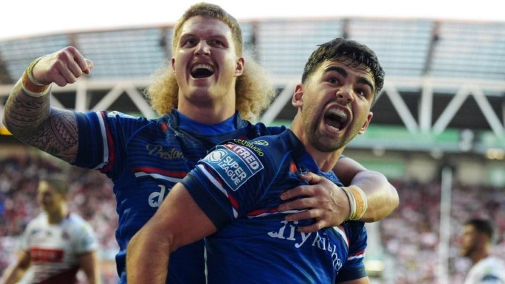 Jack Sinfield celebrates his try for Wakefield