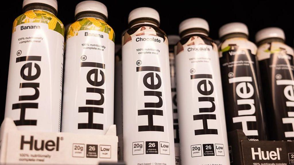 Bottles of Huel health shakes on a shelf