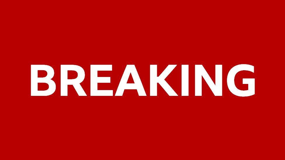 A red image with a white background that says "breaking".