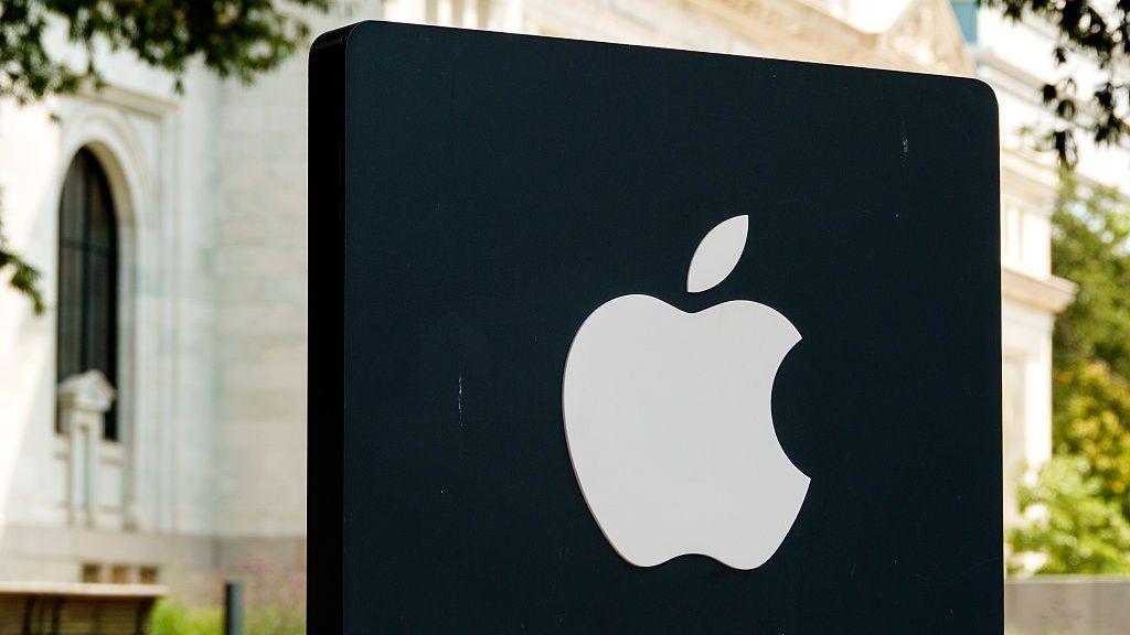 Apple logo illuminated on a black sign outside an Apple Store in Washington DC