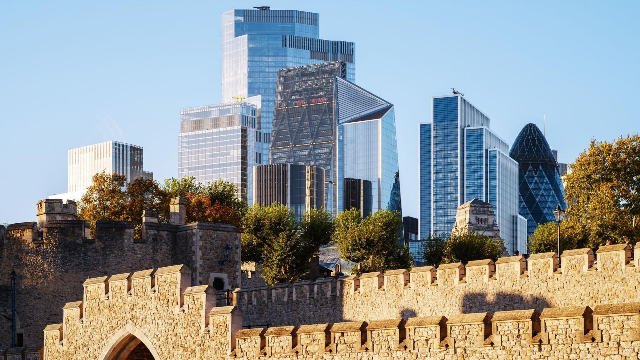 Skyscrapers and office buildings are seen behind the Tower of London.