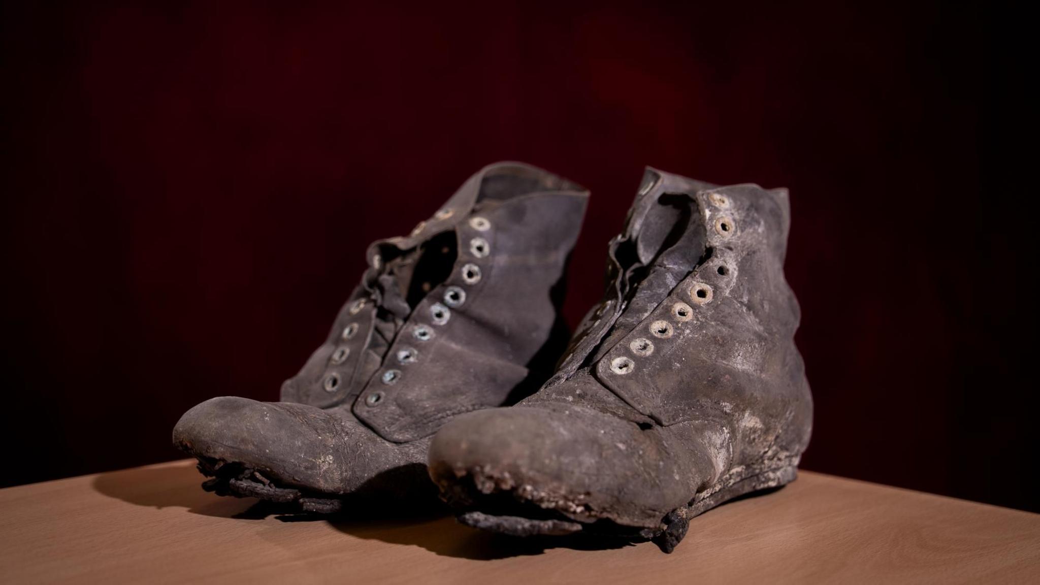 A pair of battered black hobnail boot