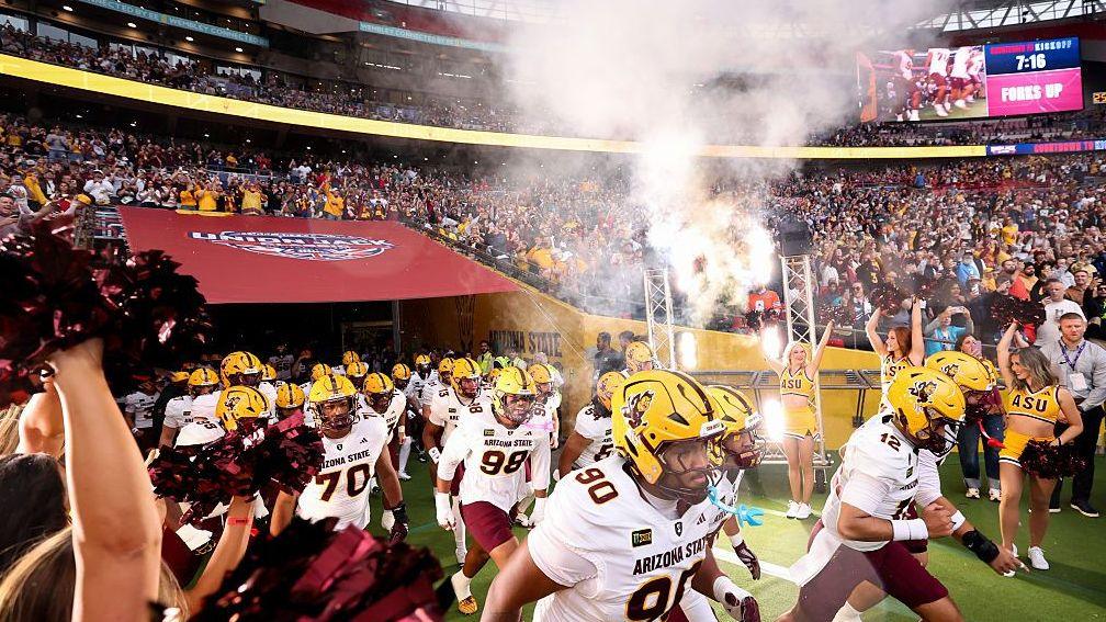 The Arizona State Sun Devils run out before the Union Jack Classic in 2026