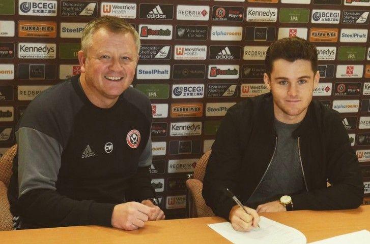 Manchester United full-back Joe Riley signs for Sheffield United on loan in 2017 watched by Blades boss Chris Wilder