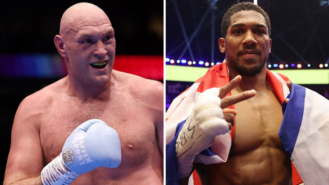 Fury says he is looking for new opponent, calls out Usyk Tyson Fury holds up his hand and is wearing a boxing glove and Anthony Joshua holds up two fingers and has a Union Jack over his shoulders
