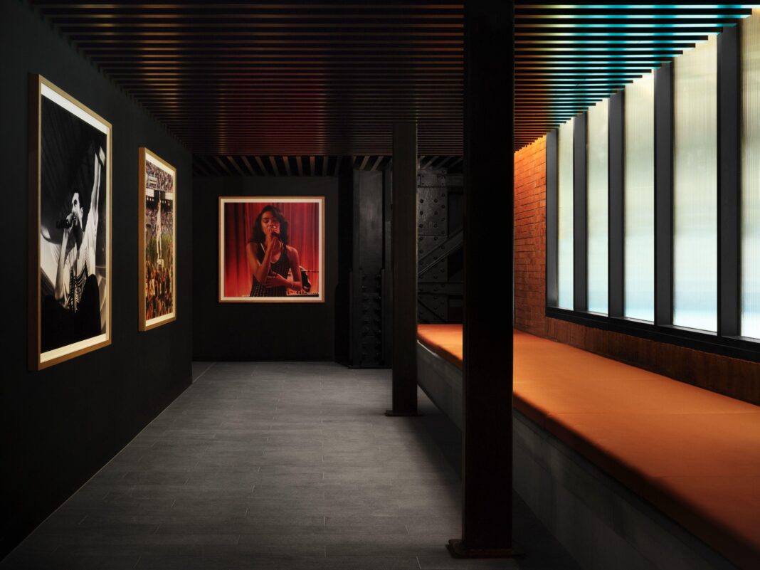 Apple Music to open concert venue in Battersea A corridor featuring photos of artists including Olivia Dean on the wall
