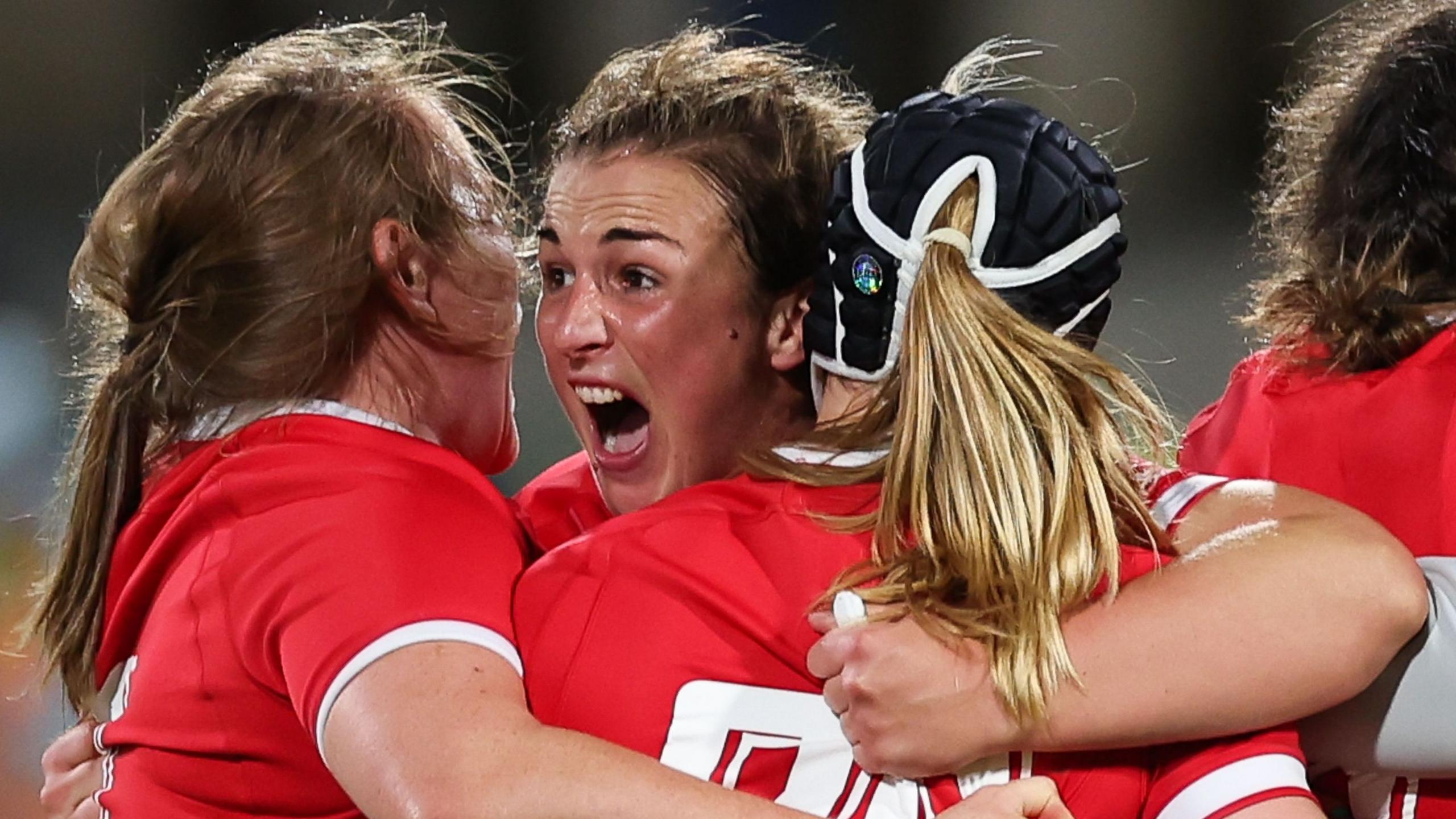 Siwan Lillicrap celebrates with her Wales teammates.
