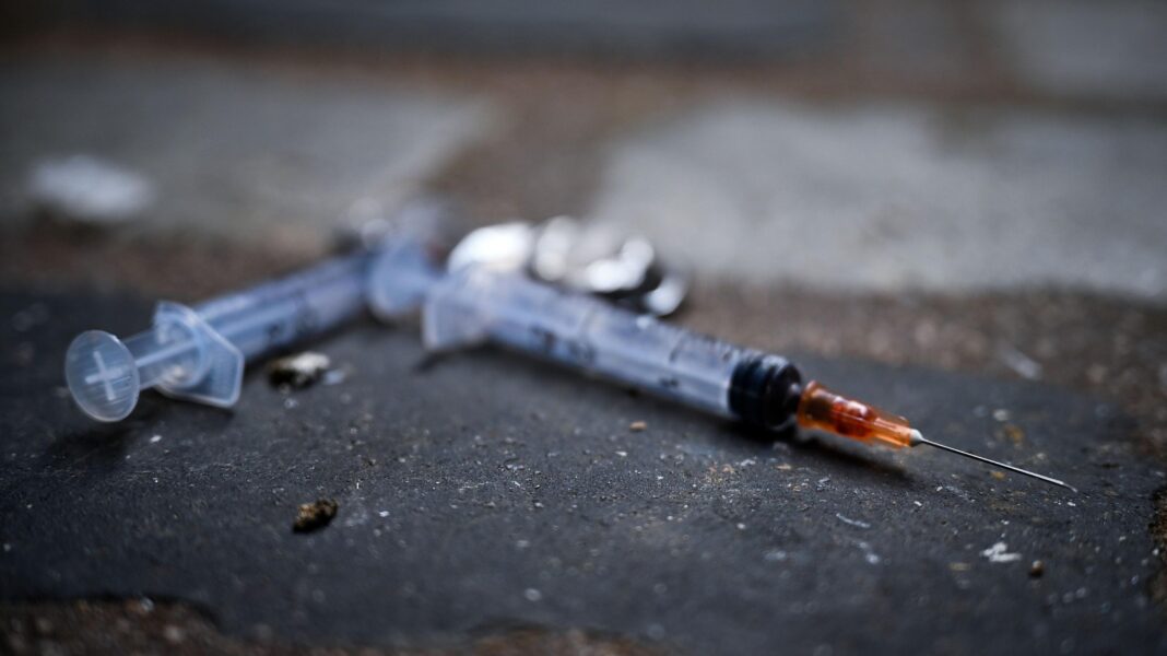 Drug deaths in Scotland rise 11% as country struggles with worst rate in Europe Needles littering the pavement in a lane in Glasgow