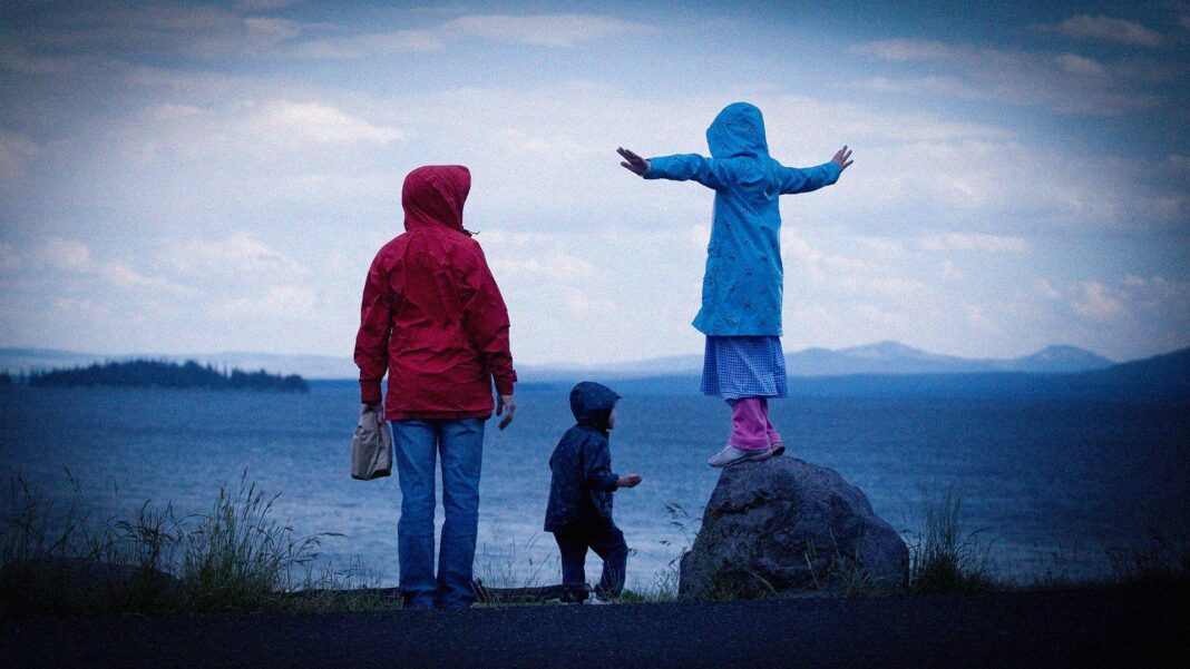 Why more women carry the ‘mental load’ – and how couples can share it A mother with her two children by the sea