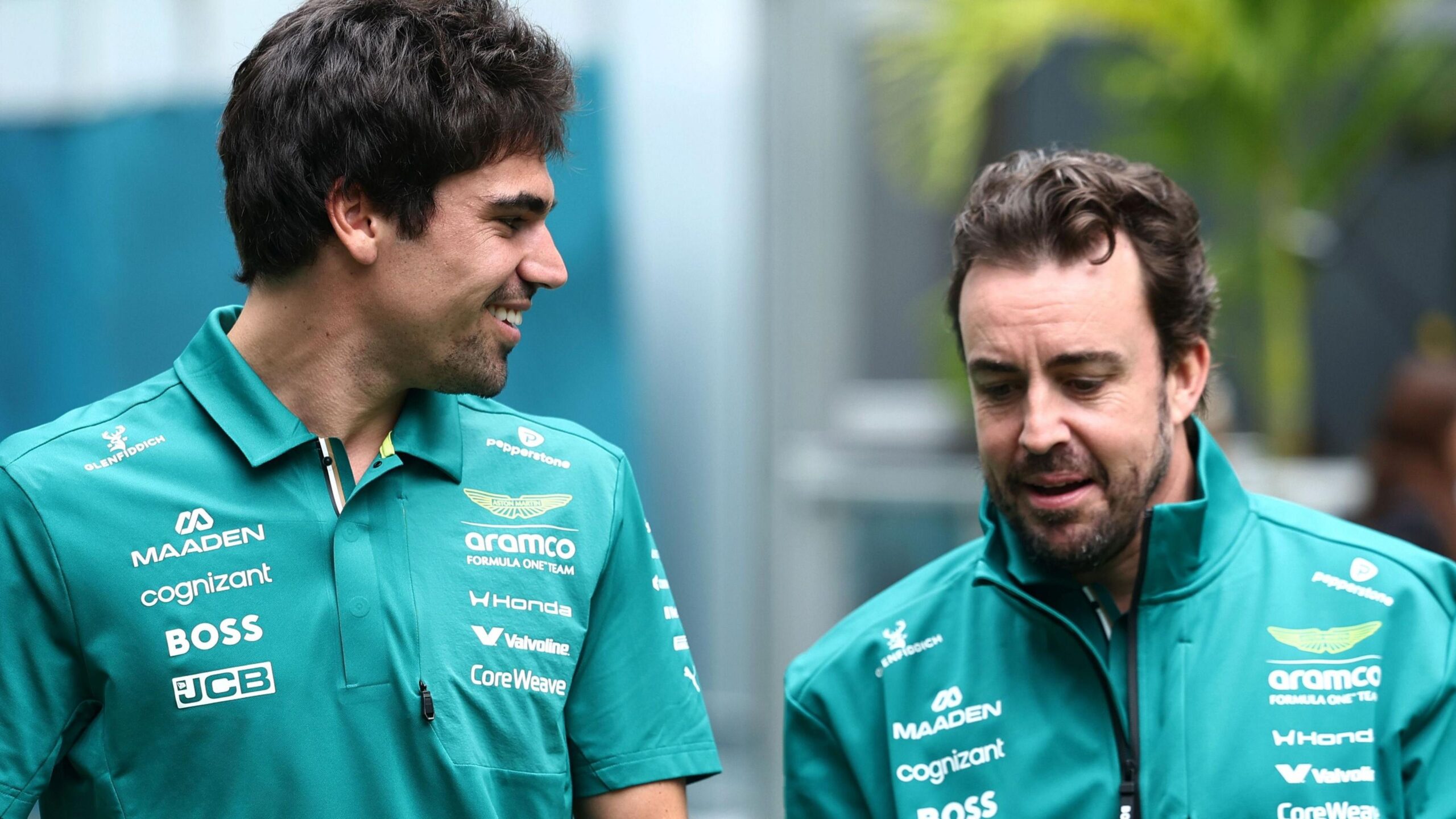 Aston Martin team-mates Lance Stroll and Fernando Alonso in conversation at the 2026 Miami Grand Prix