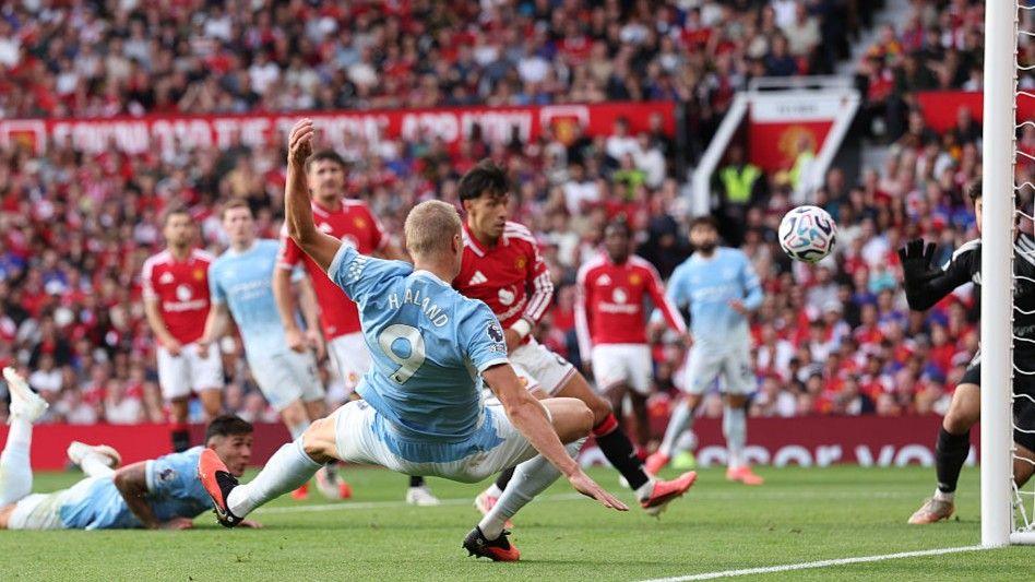 Manchester City striker Erling Haaland scores against Manchester United