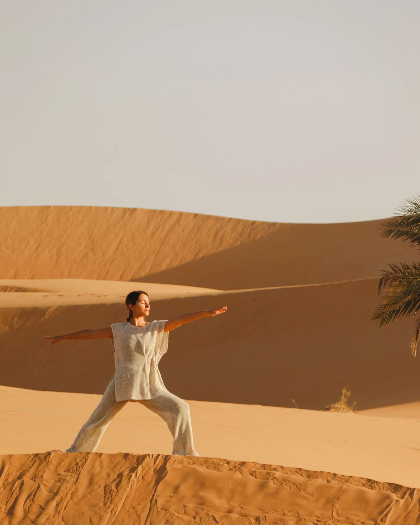 Image may contain Desert Nature Outdoors Face Head Person Photography Portrait Soil Dune Sand Horizon and Sky