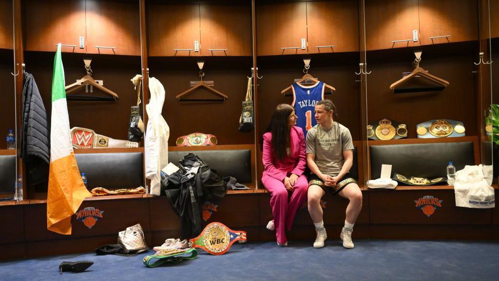 Bridget Taylor and Kate Taylor share a moment sitting beside each other in MSG's dressing room