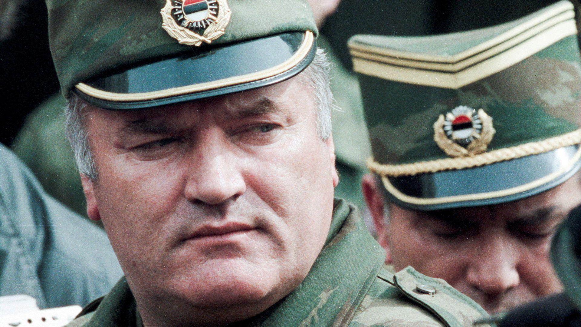 Bosnian Serb General Ratko Mladic leaves a meeting at the airport in Sarajevo, Bosnia and Herzegovina April 13, 1993. He is wearing a green and gold military peaked cap.