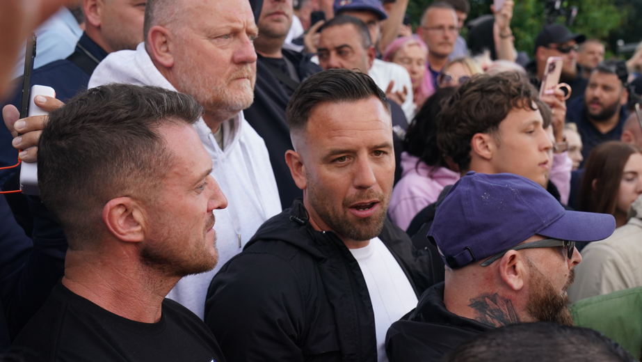 Daniel Thomas appearing at an anti-migrant protest in June