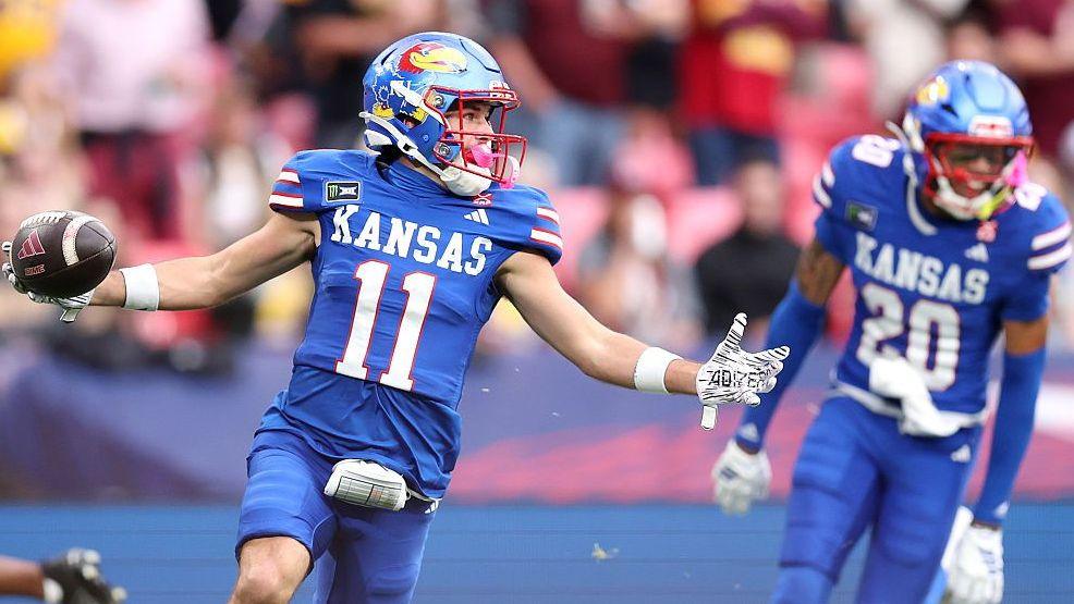 Tate Nagy celebrates scoring a touchdown for the Kansas Jayhawks against the Arizona State Sun Devils at Wembley
