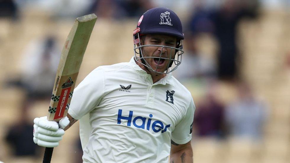 Sam Hain jumps up to celebrate scoring a century