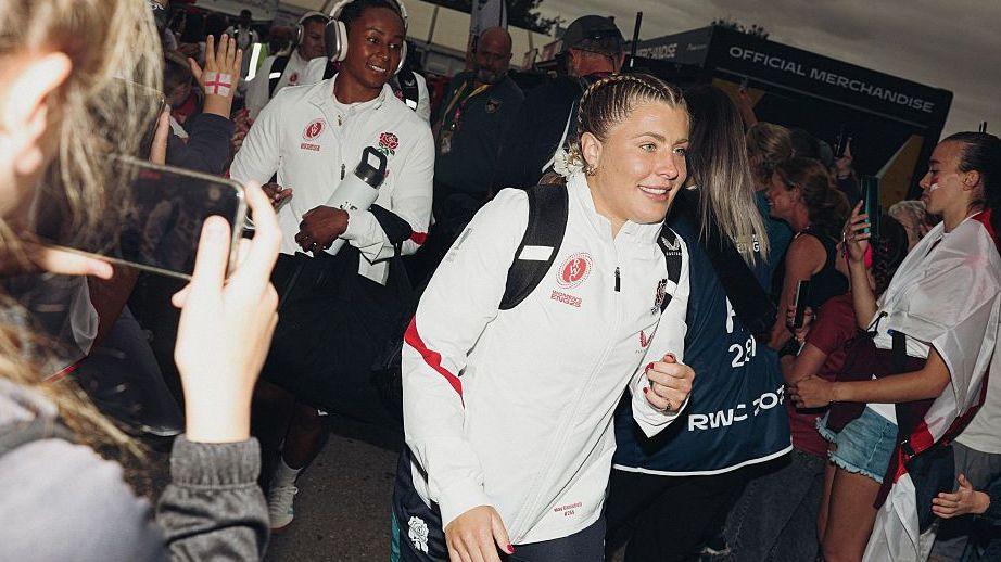 `May Campbell walks into the Franklin's Gardens