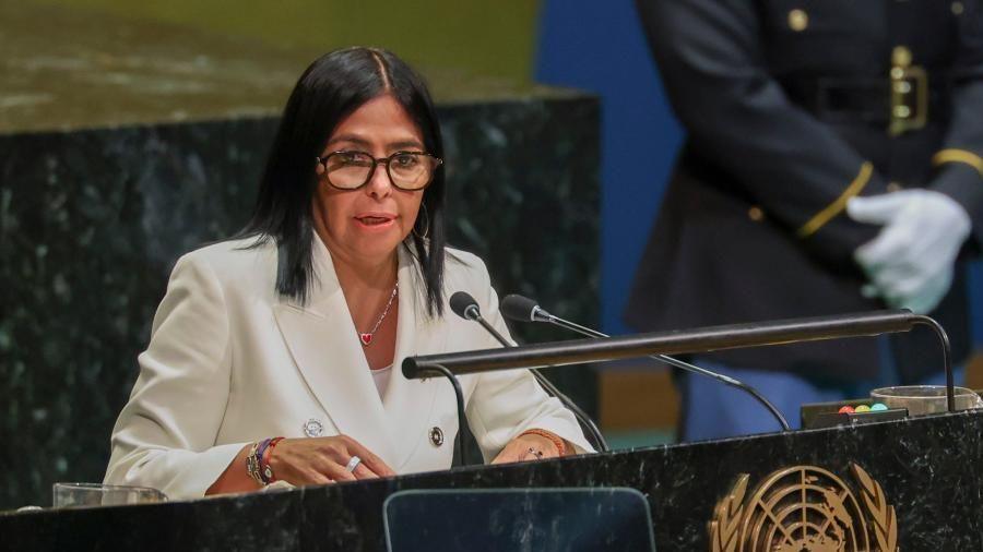 Interim President of Venezuela Delcy Rodríguez speaks during the General Debate of the 81st session of the United Nations General Assembly at United Nations Headquarters in New York on 23 September 2026. She is wearing a cream-coloured suit. She has black, straight hair and is wearing black-rimmed glasses and a heart-shaped locket from a gold chain around her neck.