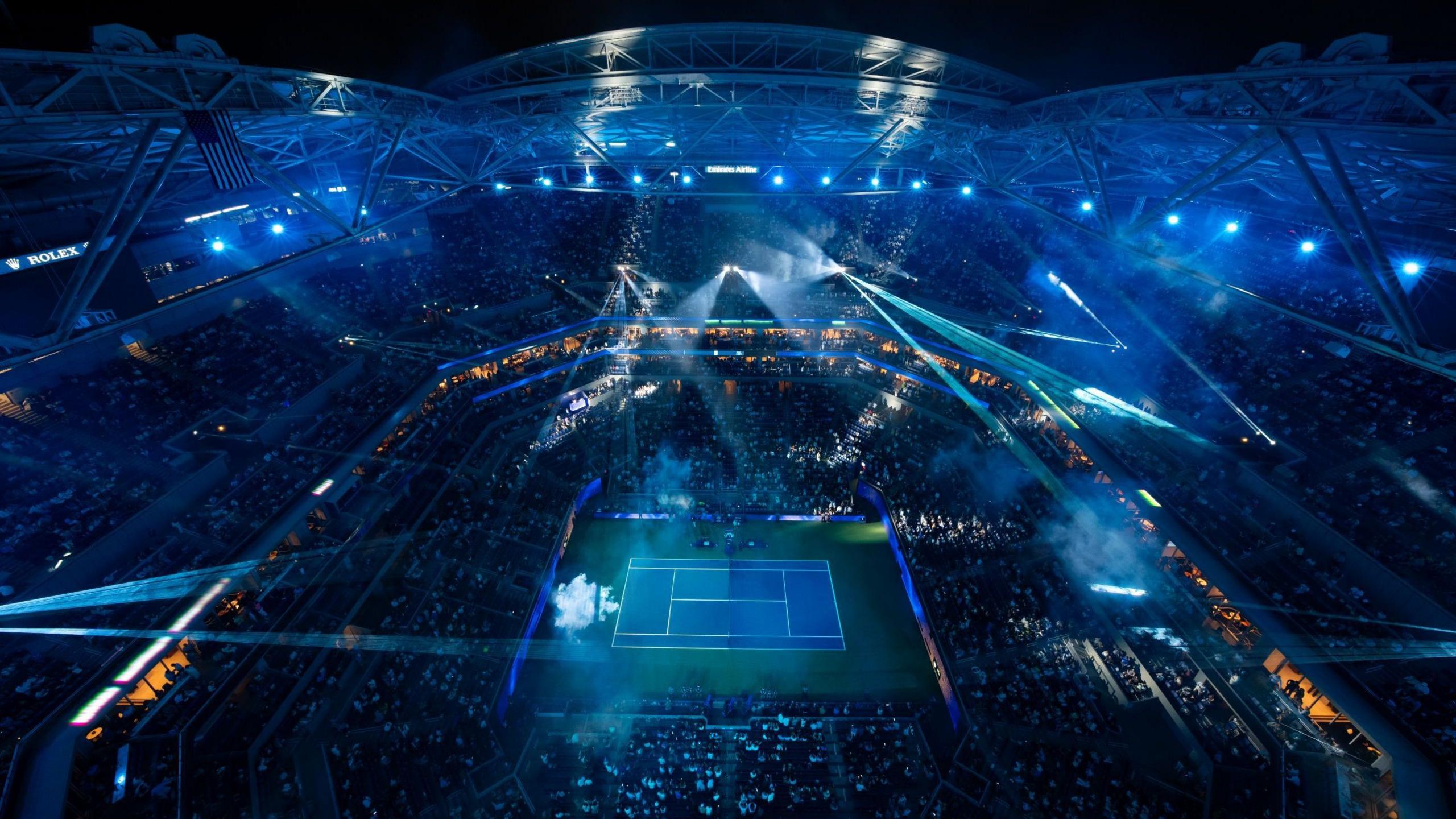 A view above Arthur Ashe Stadium as a light show takes place before the night session