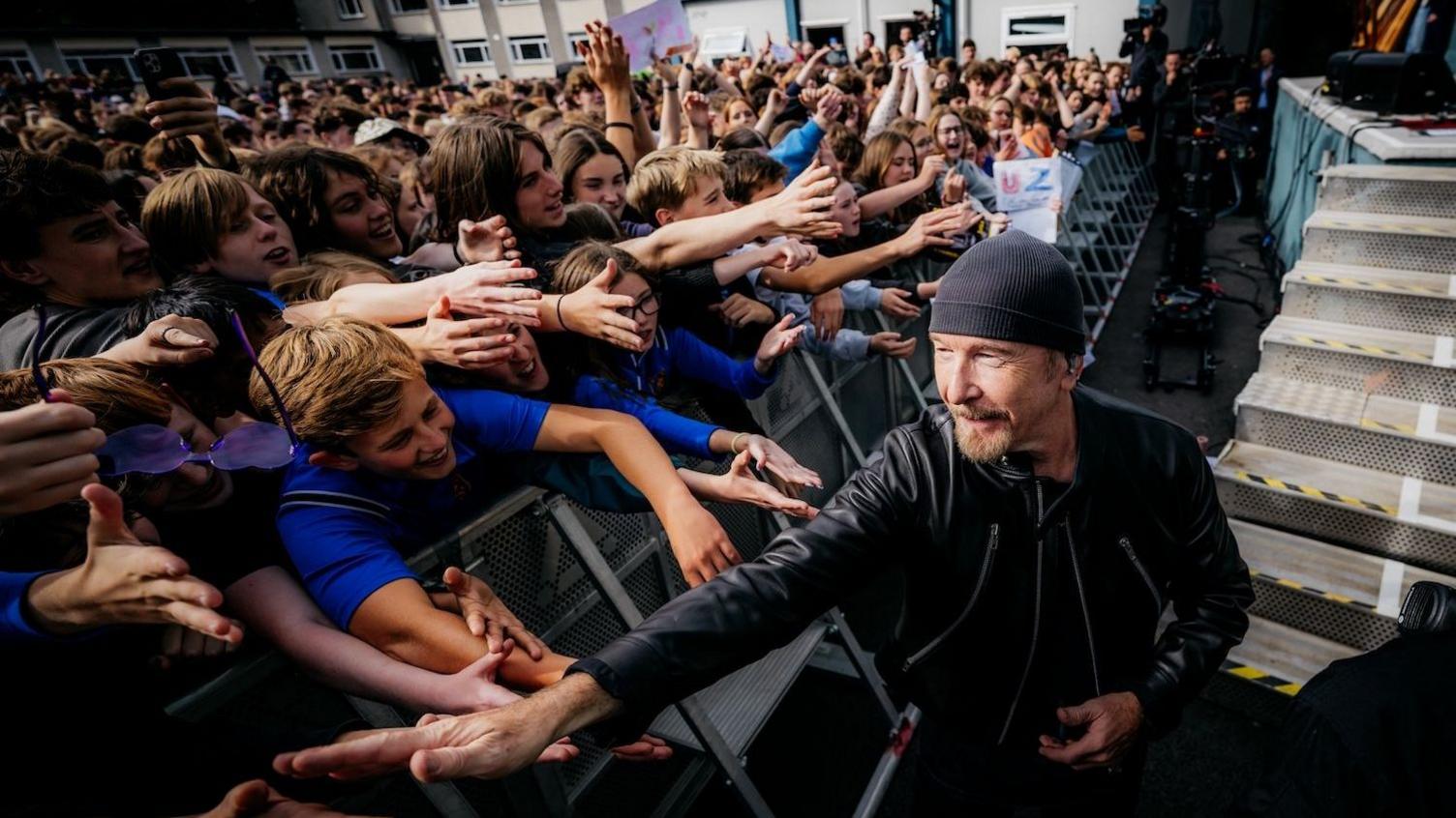 The Edge greets pupils at Mount Temple School