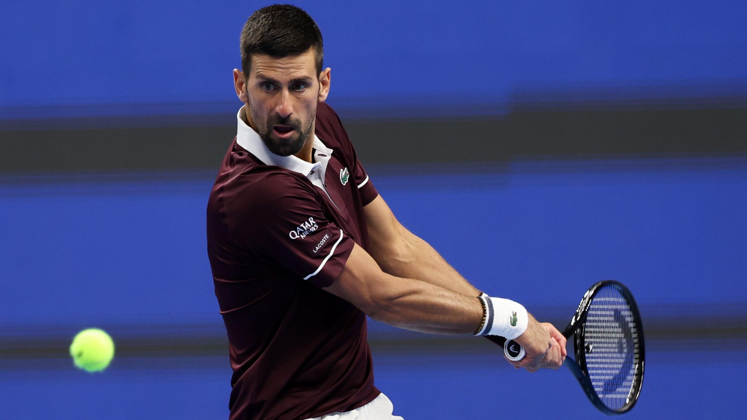 Novak Djokovic plays a backhand at the China Open in Beijing
