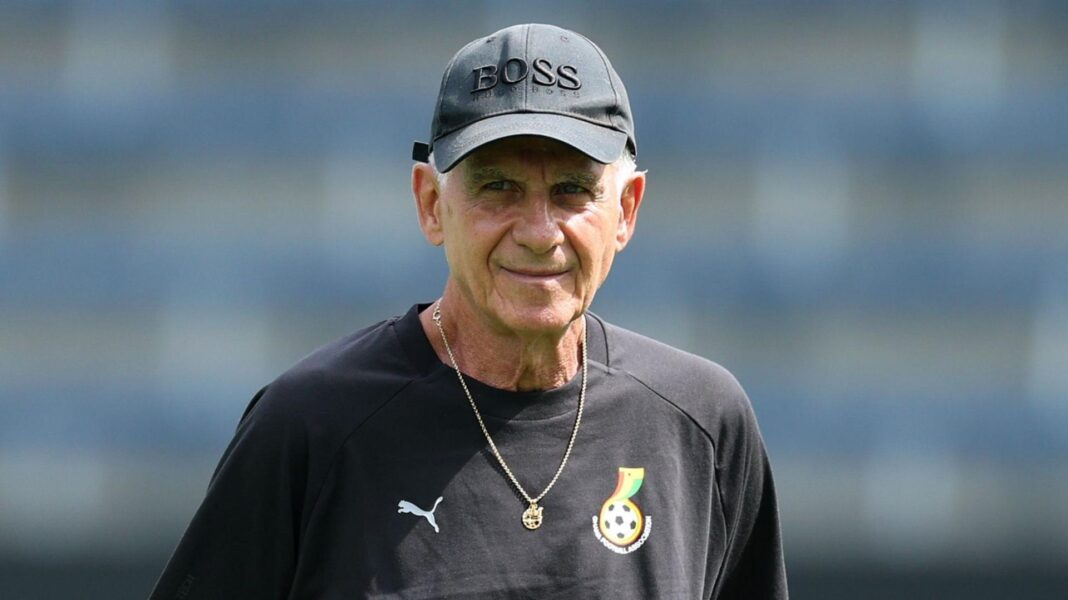 Carlos Queiroz is seen wearing a black Ghana training shirt, a necklace and a baseball cap with the word 'boss' on it