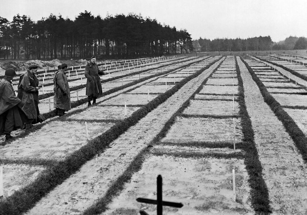 German prosecutors investigate 105-year-old for crimes at Nazi PoW camp A black and white pictured showing men in a graveyard
