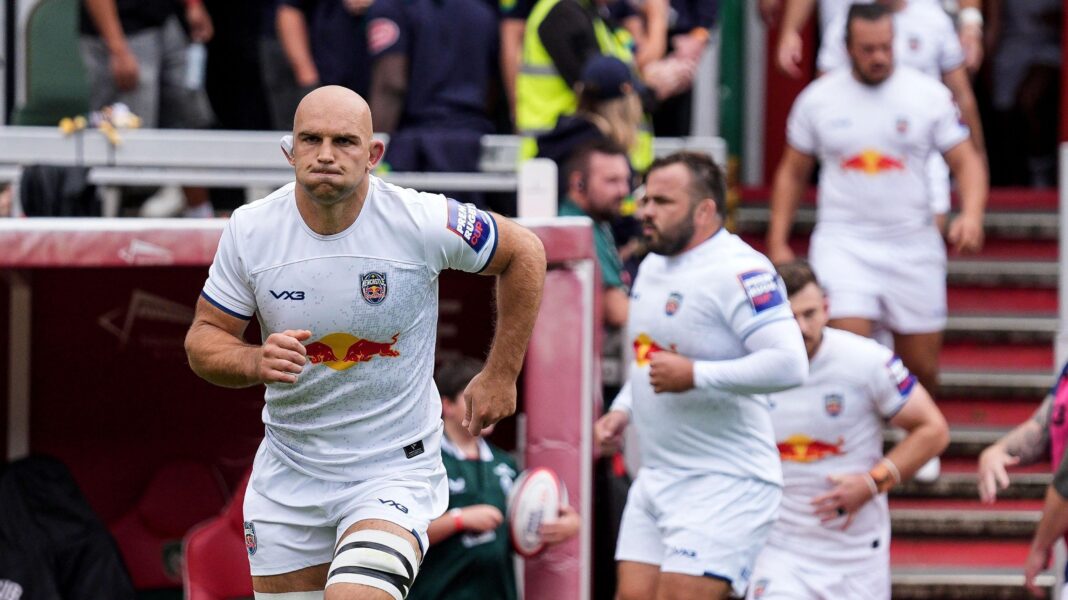 Captain Tom Christie leads out Newcastle Red Bulls in a white kit before their Prem Rugby Cup match at Leicester