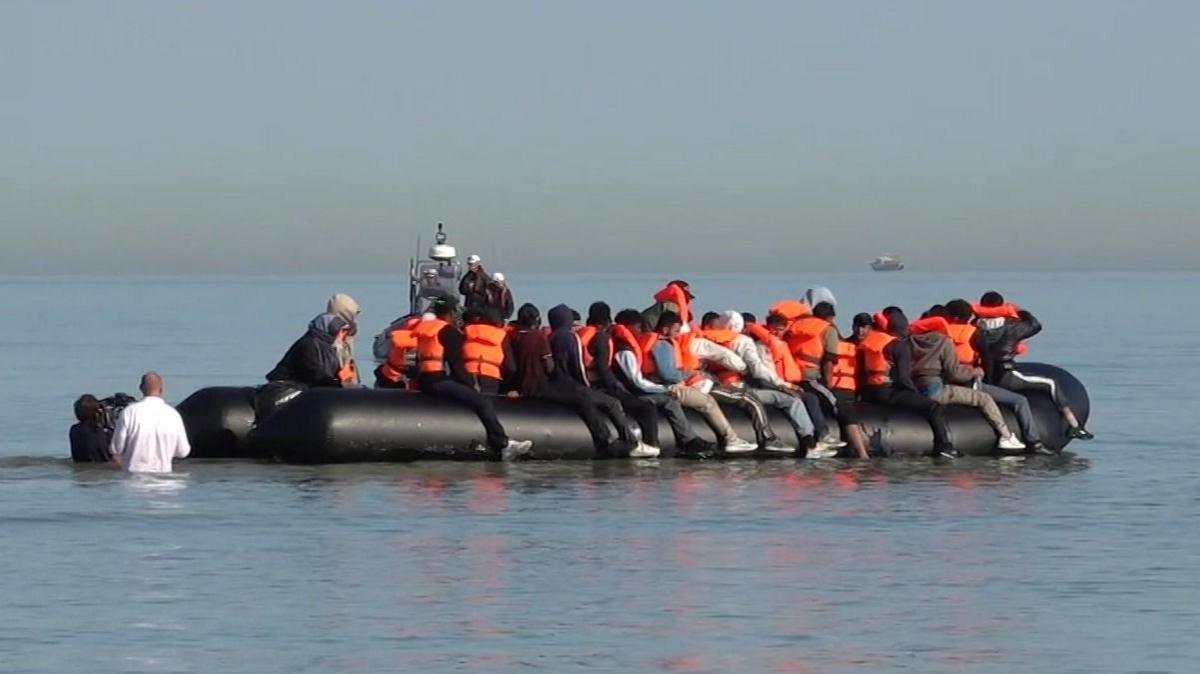 A group of migrants on a dingy off the coast of Gravelines, in a grab from the BBC video.